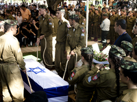 Family and relatives mourn during the funeral of Daniel Kedmi, an infantry soldier, training to be a squad commander, during his funeral at...