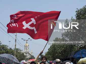 One of the left front supporter is holding the party flag up during the rally.  Kolkata, India, 22 May 2017 After the massive defeat in thre...