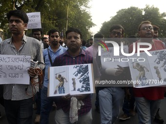 Indian  Journalists  take parts in a protest rally after  assaulted by the Kolkata Police on Monday while covering clashes between police an...