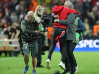 Jose Mourinho, Manager of Manchester United and his son Jose Mario Mourinho JR. celebrate victory following the UEFA Europa League Final bet...