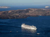 Cruise ship in the Aegean Sea by the Caldera near Santorini Island, Greece. (