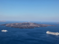Cruise ships in the Aegean Sea by the Caldera near Santorini Island, Greece. (