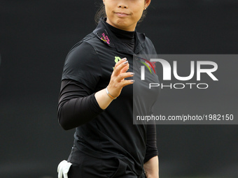 Moriya Jutanugarn of Thailand acknowledge the crowd after finishing the first round of the LPGA Volvik Championship at Travis Pointe Country...