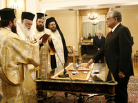 File photo of Greek PM Lucas Papademos during the sworn in ceremony, at the Presidential mansion, in Athens on November 11, 2011  (