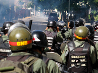 Anti-government protesters clash with security forces in Caracas, Venezuela, Friday, May 26, 2017. Venezuelans took to the streets in an att...