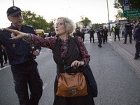Woman asks policeman about safe way during strike near Powszechny theatre in Warsaw on May 27, 2017.   Sit-in strike named 