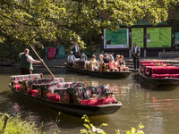 Visitors enjoy the sunny weekend day on a boat in the small harbour of Luebbenau in the region of the Spreewald, Germany on May 27, 2017.  T...