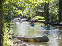 People paddle on kayaks in sunny weekend day in a canal in Luebbenau in the region of the Spreewald, Germany on May 27, 2017.  The Spreewald...