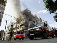 A Smoke at a home after it was hit by an Israeli air strike in Rafah, the southern Gaza Strip, on July 31, 2014. At least 10 people were kil...