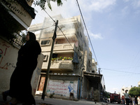 A Smoke at a home after it was hit by an Israeli air strike in Rafah, the southern Gaza Strip, on July 31, 2014. At least 10 people were kil...