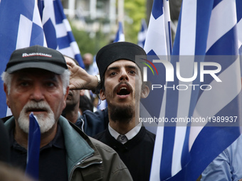 Supporters of the ultra nationalist party Golden Dawn attend a rally in central Athens on Monday May 29, 2017  to commemorate the anniversar...