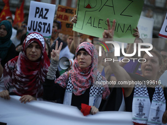 Protestors shout anti-israeli slogans as they attend a protest against the Israeli bombings in the Gaza strip, in Madrid, Thursday July 31,...