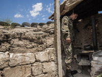 Soldier of Nagorno Karabakh army  prepares coffee in the trenches close to Martakert frontline, less than 300 meters of the Azerbaijan army...