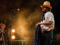 Venaria, Italy - 2014:07:31 - The songwriter Vinicio Capossela performed live with the Post Band in an animated folk concert. (