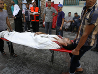 A wounded Palestinian man arrives at the al-Kuwaiti hospital a after an Israeli air strike in Rafah, in the southern Gaza Strip on August 2,...