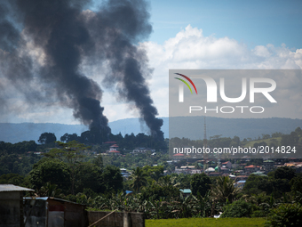 A smoke following an airstrikes by Philippine Air Force in Marawi city, southern Philippines on June 11, 2017. Philippine military jets fire...