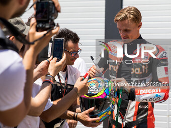 Chaz Davies of Aruba.it Racing - Ducati sign autographs after the free practice 1 of the Motul FIM Superbike Championship, Riviera di Rimini...