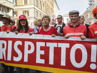 Susanna Camusso (C), CGIL General Secretary, attends a demonstration to protest against the reintroduction of a new type of work 'voucher' s...