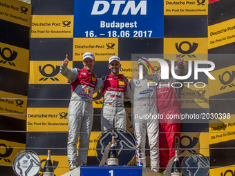 1st René Rast, 2nd Mattias Ekström and 3rd Maxime Martin standing on the podium after the Hungarian DTM race on June 18, 2017 in Mogyoród, H...