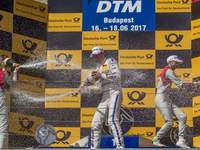 1st René Rast, 2nd Mattias Ekström and 3rd Maxime Martin standing on the podium after the Hungarian DTM race on June 18, 2017 in Mogyoród, H...