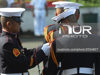 MANILA, Philippines - Members of the Philippine Marines fix their uniforms in preparation for the full military honors for the 8 Marines kil...