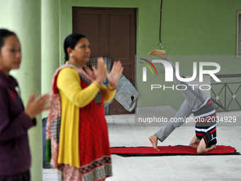 Nepalese yoga enthusiast people performing Yoga Position during the celebration of International Day of Yoga organized by Yog Sadhana Samaj...