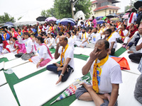 Nepalese yoga enthusiast people performing Yoga Position during the celebration of International Day of Yoga at Kathmandu, Nepal on Wednesda...