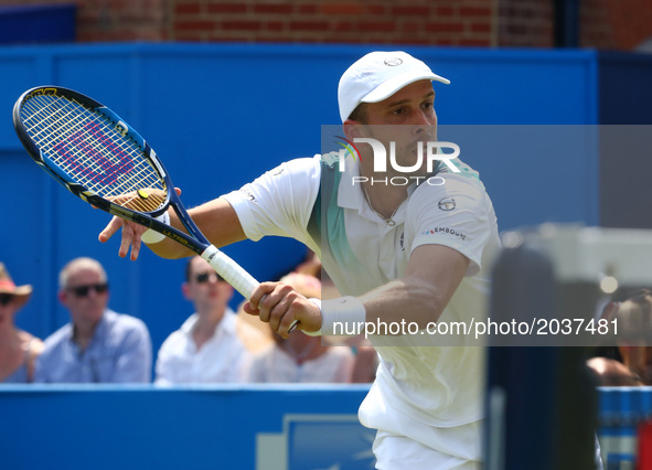 Gilles Muller LUX against Jo-Wilfried Tsonga FRA during Round Two match on the third day of the ATP Aegon Championships at the Queen's Club...