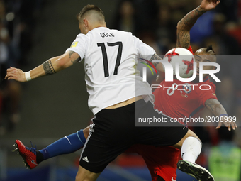 Niklas Suele (L) of Germany national team and Arturo Vidal of Chile national team vie for the ball during the Group B - FIFA Confederations...
