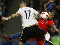 Niklas Suele (L) of Germany national team and Arturo Vidal of Chile national team vie for the ball during the Group B - FIFA Confederations...