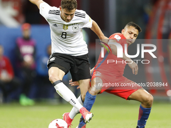 Leon Goretzka (L) of Germany national team and Alexis Sanchez of Chile national team vie for the ball during the Group B - FIFA Confederatio...