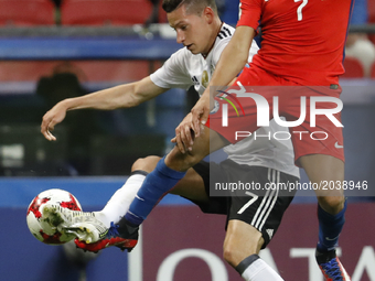 Julian Draxler (L) of Germany national team and Alexis Sanchez of Chile national team vie for the ball during the Group B - FIFA Confederati...
