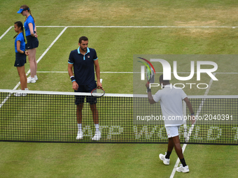 Marin Cilic of Croatia (C) beats Donald Young (R) of the US in the quarter finals of AEGON Championships at Queen's Club, London, on June 23...