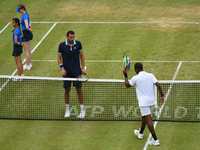 Marin Cilic of Croatia (C) beats Donald Young (R) of the US in the quarter finals of AEGON Championships at Queen's Club, London, on June 23...