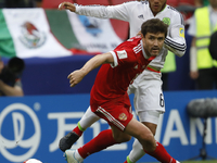Yury Zhirkov (L) of Russia national team and Jonathan Dos Santos of Mexico national team vie for the ball during the Group A - FIFA Confeder...