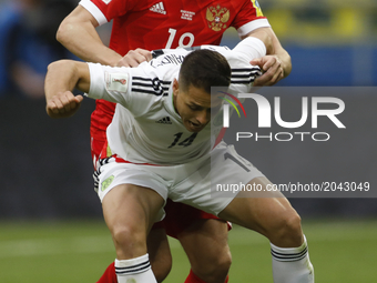 Yury Zhirkov of Russia national team and Javier Hernandez (in front) of Mexico national team vie for the ball during the Group A - FIFA Conf...