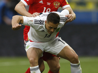 Yury Zhirkov of Russia national team and Javier Hernandez (in front) of Mexico national team vie for the ball during the Group A - FIFA Conf...