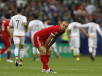 Denis Glushakov of Russia national team reacts as Mexico national team players celebrate a goal during the Group A - FIFA Confederations Cup...