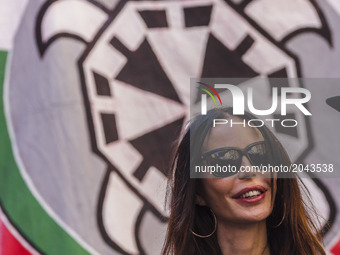 Nina Moric, a Croatian fashion model, smiles as thousands of members of Italian far-right movement CasaPound from all over Italy march with...