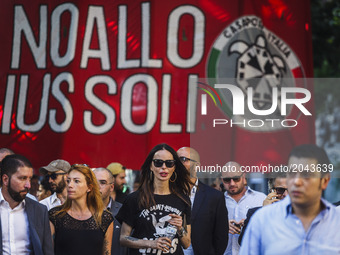 Nina Moric (C), a Croatian fashion model, marches as thousands of members of Italian far-right movement CasaPound from all over Italy march...