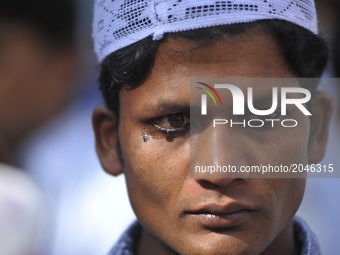Nepaleses muslim gets 'surma' a herbal eye-liner applied on his eyes before offering ritual morning prayers during celebration of Eid al-Fit...