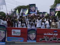 Members of a non-governmental organization 'Youth Forum for Kashmir' chant anti Indian slogans during a rally to mark 1st anniversary of the...