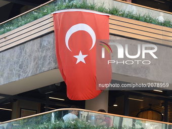 A Turkish flag is seen on the wall of a restaurant marking the 1st anniversary of Turkey's failed coup attempt in Ankara, Turkey on July 14,...