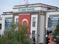 A huge Turkish flag and banners of the Turkish presidency are seen on the wall of a building of Ministry of Health marking the 1st anniversa...