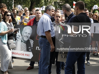 A few hundred activists and media representatives march downtown Kyiv, Ukraine pass by the President Office and Internal Ministry from the s...