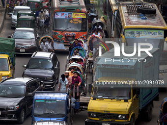 Hazardous road crossing made traffic jam in Dhaka, Bangladesh on July 23, 2017. Dhaka last 10 years, average traffic speed has dropped from...
