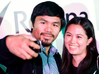 Makati, Philippines - Manny Pacquiao poses for a picture with a fan during a promotional event held in Makati on August 12, 2014. The Filipi...