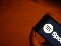 In this photo illustration, the logo of the music streaming service Spotify is displayed on a smart phone in Ankara, Turkey on August 02, 20...