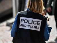 A French police official stands alert at the site after colleagues arrested a suspect on the A16 motorway, near Marquise, northern France, o...