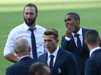 Gonzalo Higuain and Douglas Costa of Juventus during the Juventus Walk Around ahead of the Italian Supercup at Olimpico Stadium on August 12...